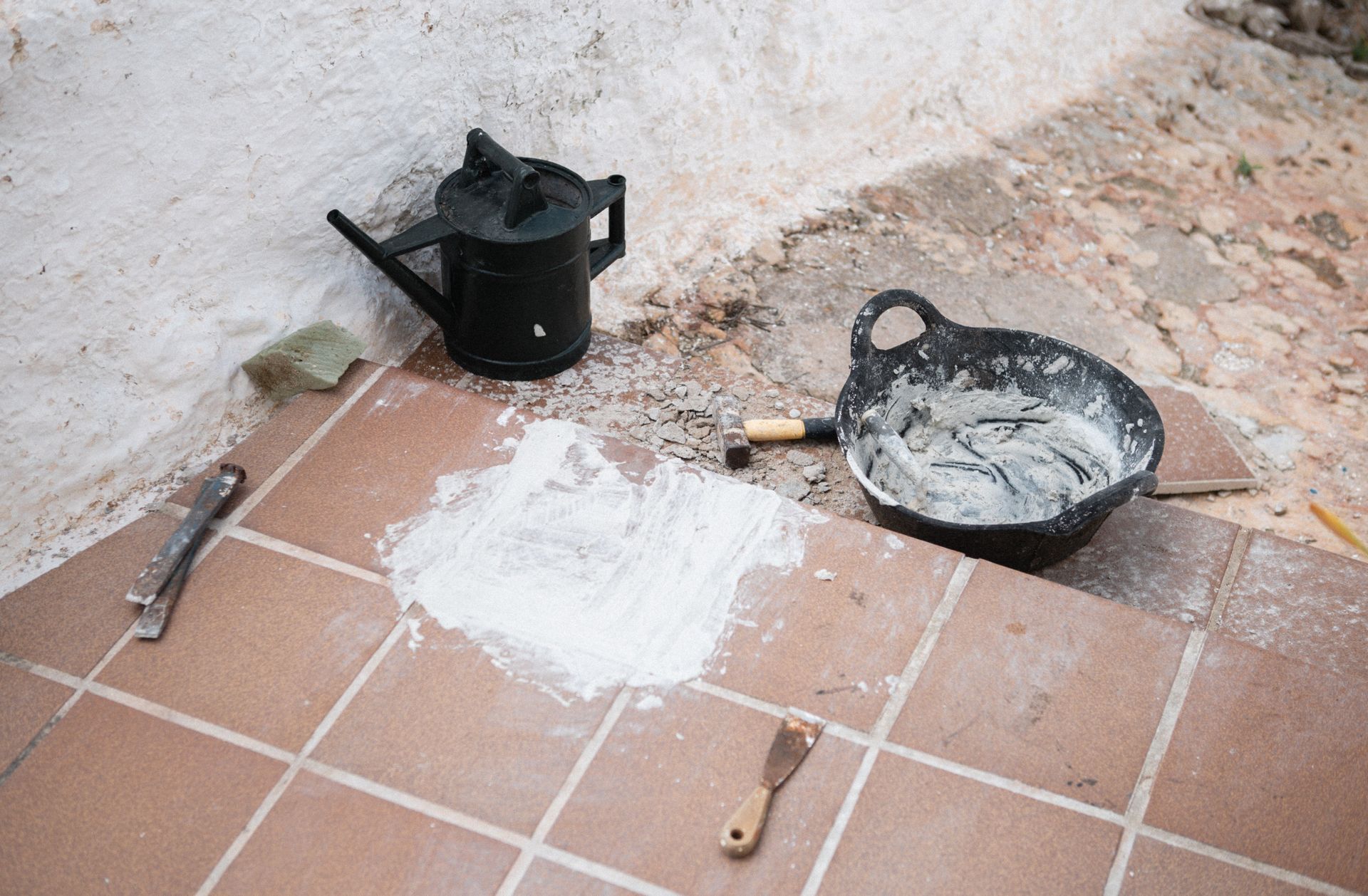 Construction tools and materials on tiled floor, Ciutadella de Menorca, Balearic Islands.